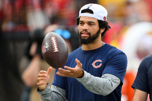 Bears quarterback Caleb Williams tosses a football during warmups before a preseason game against the Chiefs on Aug. 22, 2024 in Kansas City, Mo. (AP Photo/Reed Hoffmann)