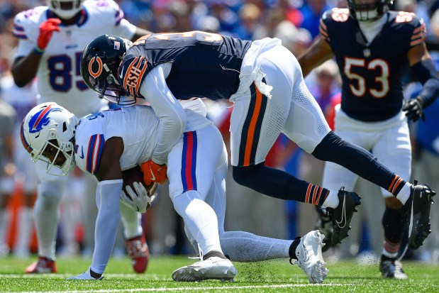 Buffalo Bills wide receiver Curtis Samuel, left, is tackled by Chicago Bears defensive back Kevin Byard III during the first half of a preseason NFL football game in Orchard Park, N.Y., Saturday, Aug. 10, 2024. (AP Photo/Adrian Kraus)