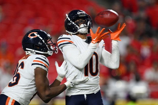 Chicago Bears wide receiver Tyler Scott (10) catches a kickoff in front of teammate wide receiver John Jackson III (26) during the second half of an NFL preseason football game against the Kansas City Chiefs, Thursday, Aug. 22, 2024 in Kansas City, Mo. (AP Photo/Reed Hoffmann)