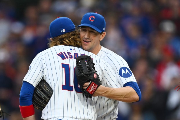 Cubs starting pitcher Kyle Hendricks hugs Patrick Wisdom after being pulled in the top of the eighth inning against the Reds on Sept. 28, 2024, at Wrigley Field. (Quinn Harris/Getty)