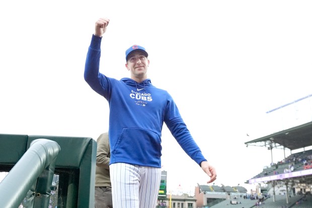 Kyle Hendricks acknowledges the crowd after the Cubs' 3-0 victory against the Reds on Sept. 28, 2024, at Wrigley Field. (Charles Rex Arbogast/AP)