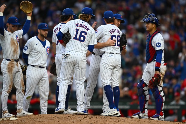 Cubs starter Kyle Hendricks hugs pitching coach Tommy Hottovy upon being pulled in the top of the eighth inning against the Reds on Sept. 28, 2024, at Wrigley Field. (Quinn Harris/Getty)