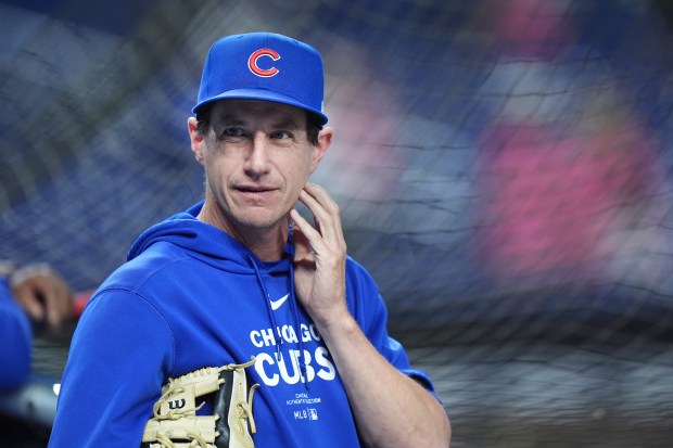 Chicago Cubs manager Craig Counsell looks on as the team warms up before the start of a baseball game against the Miami Marlins, Friday, Aug. 23, 2024, in Miami. (AP Photo/Wilfredo Lee)