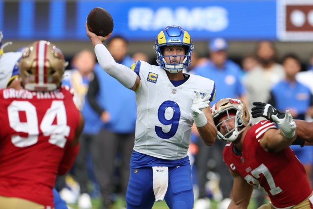 Rams quarterback Matthew Stafford passes between 49ers defensive ends Yetur Gross-Matos (94) and Nick Bosa during the first half on Sept. 22, 2024, in Inglewood, Calif. (Ryan Sun/AP)