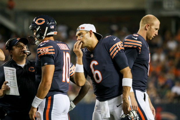 Bears quarterback Mark Sanchez (6) talks with Mitch Trubisky (10) while Mike Glennon walks away during a preseason game against the Broncos on Aug. 10, 2017, at Solider Field. (Armando L. Sanchez/Chicago Tribune)