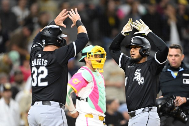 White Sox second baseman Lenyn Sosa, right, is congratulated by first baseman Gavin Sheets after hitting a game-tying two-run home run with two outs in the ninth inning against the Padres on Sept. 20, 2024, in San Diego. (Denis Poroy/Getty)