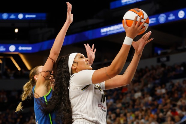 Chicago Sky center Kamilla Cardoso (10) goes to the basket past Minnesota Lynx forward Alanna Smith, left, in the third quarter of a WNBA basketball game Friday, Sept. 13, 2024, in Minneapolis. (AP Photo/Bruce Kluckhohn)