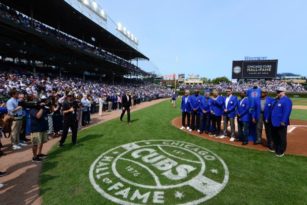 Members of the Chicago Cubs Hall of Fame pose with new members Kerry Wood and Aramis Ramirez before a baseball game between the Cubs and the New York Yankees in Chicago, Sunday, Sept. 8, 2024. (AP Photo/Paul Beaty)