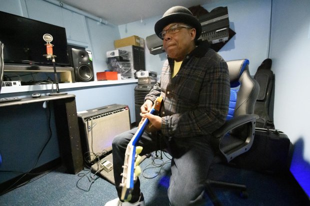 Tito Jackson, 68, takes a moment to perform with West Side Leadership Academy students in their school's studio in 2019. (Kyle Telechan/for the Post Tribune)