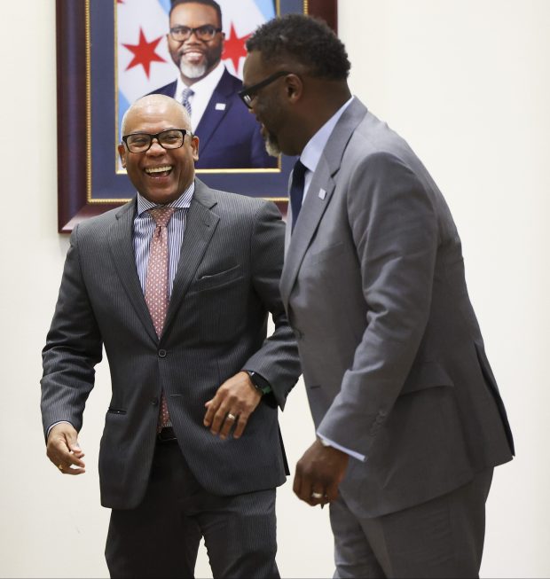 Mayor Brandon Johnson speaks with Alderman Walter Burnett, Jr., after delivering his budget proposal for 2024 on Oct. 11, 2023, at Chicago City Hall. (Eileen T. Meslar/Chicago Tribune)