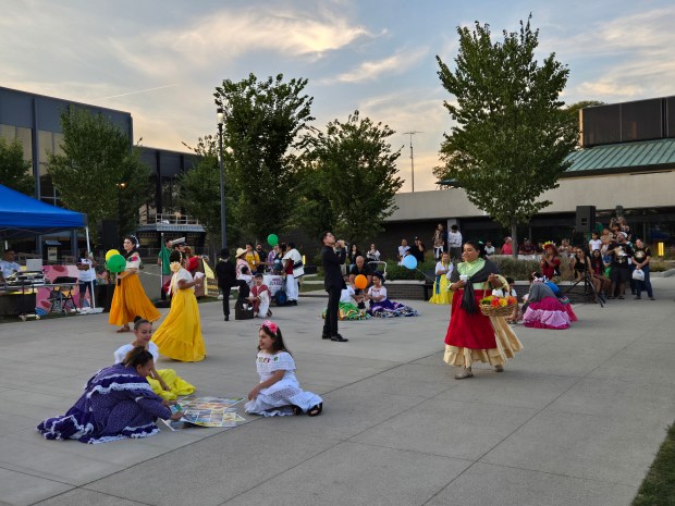 A reenactment of a day in a Mexican plaza was part of Gail Borden Public Library's celebration of Mexican Independence Day. It kicked off the city's Fiesta de Elgin, which included concerts, a caravan and fireworks. (Gloria Casas/The Courier-News)