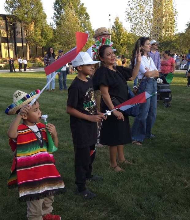 David Cabrera was decked out Friday for the start of Fiesta de Elgin two-day celebration of Mexican Independence Day. The 6-year-old watched a mariachi band with his brother Samuel, 11, and their mom, Miriam, at the Civic Center Plaza in downtown Elgin. (Gloria Casas/The Courier-News)