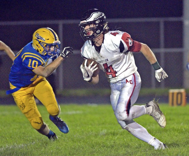 Aurora Christian wide receiver Trey Madsen, who's transferring from Evangel to Aurora University, runs for yardage in a game against Aurora Central Catholic on Friday, Sept. 7, 2018.