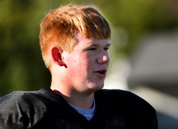 Grayslake North's Kyle Case takes a break along the sidelines during practice, Wednesday, Sept. 25, 2024. (Rob Dicker / News-Sun)