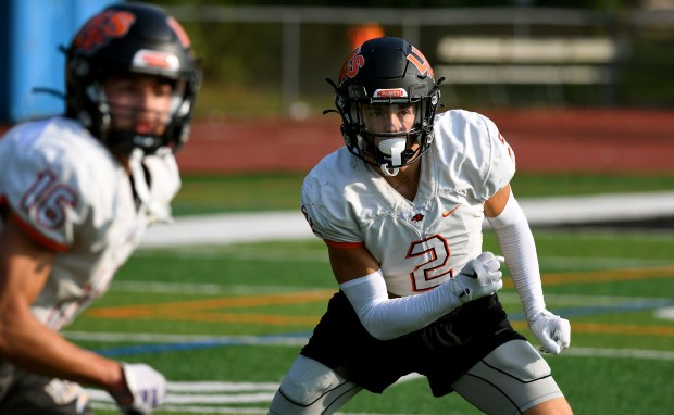 Libertyville's Mason Strader keeps his eyes on the ball as he defends against a pass at a Libertyville Wildcats practice at Libertyville High School, Wednesday, Sept. 11, 2024. (Rob Dicker / News-Sun)