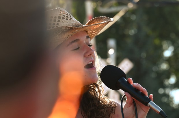 On the Hopalong Haywagon is singer Jacie Jean of Oak Lawn during Nashwood on Aug. 31, 2024 in Highwood. (Karie Angell Luc/Lake County News-Sun)