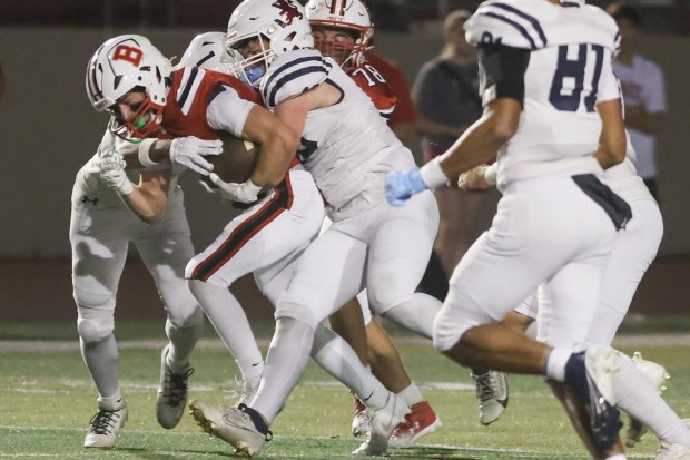 Benet's Martin Radgowski (1) runs the ball against St. Viator during a CCL/ESCC Purple game in Lisle on Friday, Sept. 20, 2024. (Troy Stolt / Naperville Sun)