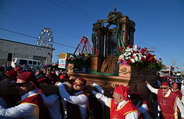 On the event midway is the Procession of the Blessed Mother with the shrine at the annual Religious Feast of Maria SS Lauretana of Altavilla Milicia in Niles on Sept. 1, 2024. (Karie Angell Luc/Pioneer Press)