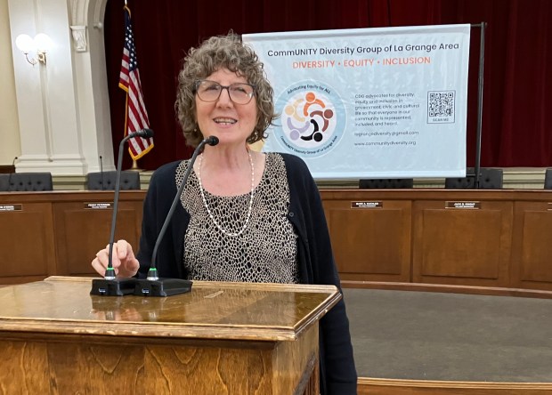 La Grange's CommUNITY Diversity Group President Marian Honel-Wilson welcomes people Sunday at the start of the 2024 Race Unity Rally in La Grange's Village Hall. (Hank Beckman/Pioneer Press)