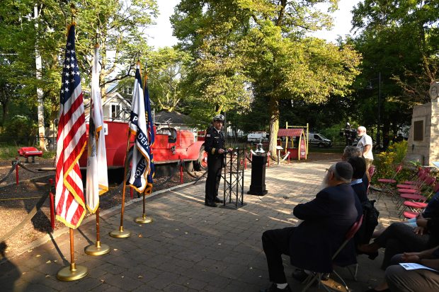 Matthew Smith, City of Evanston Fire Department division chief, addresses the audience at the City of Evanston Patriot Day Remembrance Ceremony on Sept. 11, 2024 at Firefighter's Park in Evanston. (Karie Angell Luc/Pioneer Press)