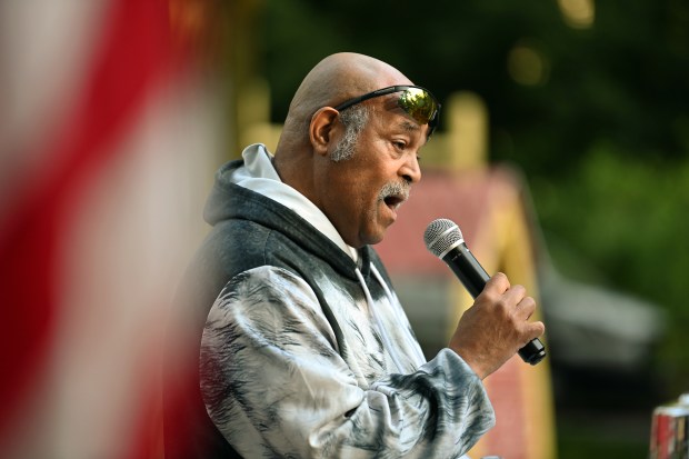 Rodney Greene of Evanston sings the national anthem at the City of Evanston Patriot Day Remembrance Ceremony on Sept. 11, 2024 at Firefighter's Park in Evanston. (Karie Angell Luc/Pioneer Press)