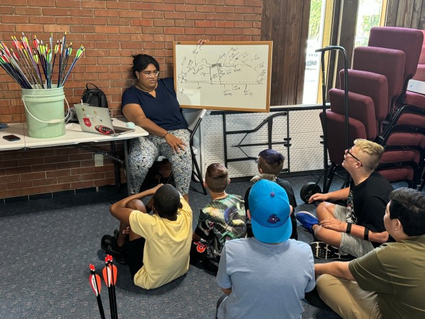 Daijah Webb, program coordinator for the Salvation Army Corps Archery Program, leads the advanced archers in a study session on the parts of the bow on Wednesday, Aug. 28, 2024, in South Haven. (Deena Lawley-Dixon/for Post-Tribune)