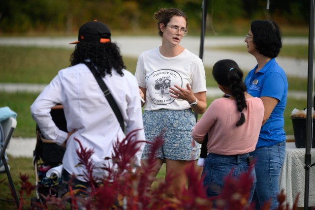 Hickory Hills Flower Farm owner Emma Bilbrey speaks with mothers and other participants in the FarmHer to Mama event on Friday, Sept. 20, 2024. (Kyle Telechan/for the Post-Tribune)