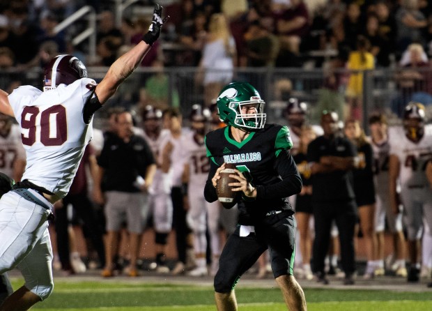 Valparaiso's Kellan Hosek prepares to pass the ball during a home game against Chesterton on Friday, Sept. 20, 2024. (Michael Gard/for the Post-Tribune)