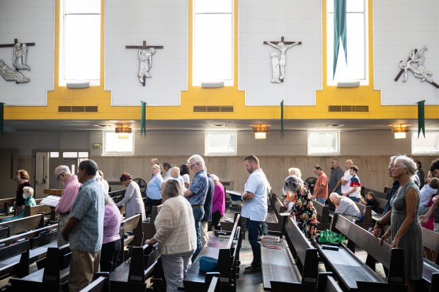 Congregants stand for mass at St. Mary of the Lake Catholic church in Gary on Sunday, Sept. 15, 2024. (Kyle Telechan/for the Post-Tribune)