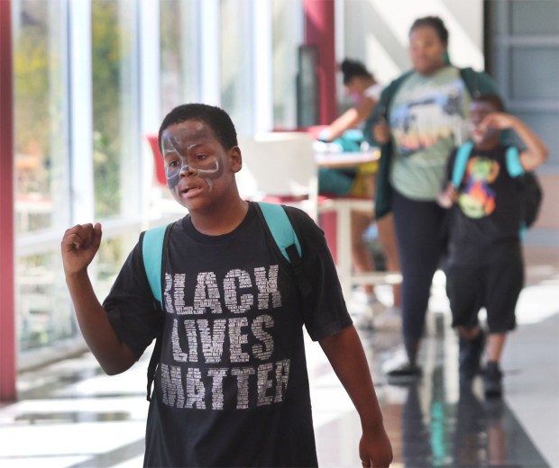 Kyree Jones 10, (left) dances to the music as he makes his way down the hallway during the Back to School Jamboree hosted by IU Northwest, previously organized by Indiana State Rep. Vernon Smith. After many years of involvement, Rep. Smith has elected to transition the event to IU Northwest. The ceremony took place on Saturday, Sept. 14, 2024. (John Smierciak/Post Tribune)