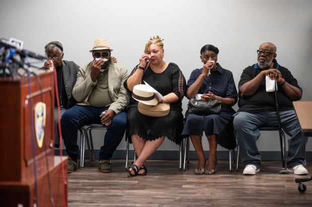 Family members of Portage resident Kia Tidwell, who was killed in a shooting in Gary last Friday, listen during a press conference at the Gary Police Department on Monday, Sept. 9, 2024. (Kyle Telechan/for the Post-Tribune)