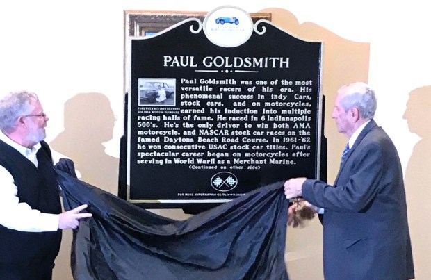 Valparaiso racing journalist William LaDow (left) and the late Paul Goldsmith unveil the latter's historical marker during a 2017 celebration of Goldsmith's accomplishments. The marker still resides at the Griffith-Merrillville Airport, which Goldsmith built and owned until shortly before he died. (Photo courtesy of William LaDow)