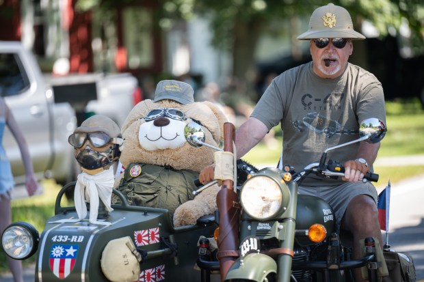 Valparaiso resident Dennis Seramur rides on a vintage motorcycle, used in the China India Burma theater in World War II, as he participates in the annual Malden Labor Day parade on Monday, Sept. 2, 2024. (Kyle Telechan/for the Post-Tribune)