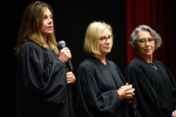 Indiana Court of Appeals judge Elizabeth Tavitas, on left, accompanied by fellow appellate judges Nancy Vaidik and Elizabeth Tavitas, answers a question from a student during an Appeals on Wheels visit to Portage High School on Thursday, Sept. 26, 2024. (Kyle Telechan/for the Post-Tribune)