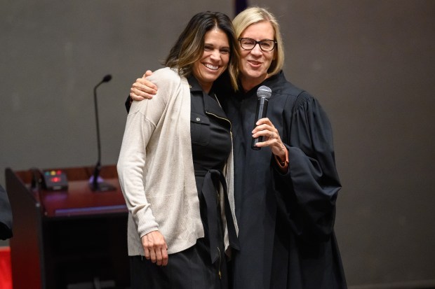 Indiana Court of Appeals Judge Nancy Vaidik, on right, hugs soon-to-be Appeals Court Judge Mary DeBoer on stage after an Appeals on Wheels oral argument at Portage High School on Thursday, Sept. 26, 2024. (Kyle Telechan/for the Post-Tribune)