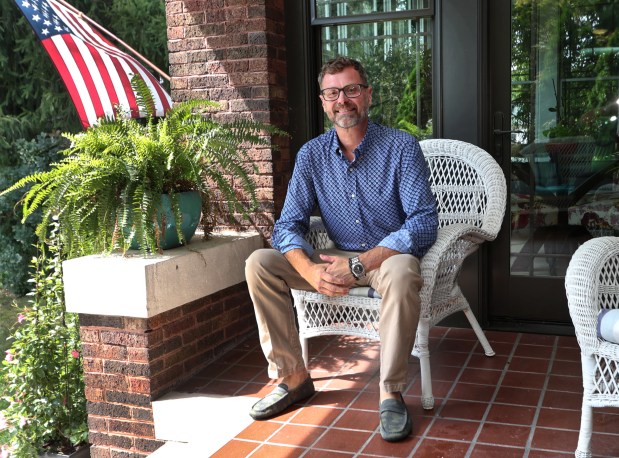 Area Realtor Christopher Jones is impacted by the realtor's commission shift that has occurred amid a national lawsuit settlement. Jones is shown in his home on Friday, Aug. 30, 2024. (John Smierciak/Post-Tribune)