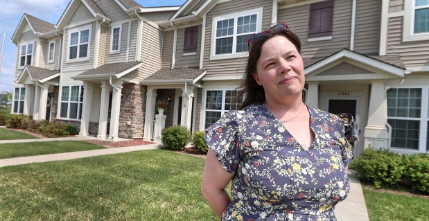 Area realtor, Lisa Wozniakowski, is impacted by the realtor's commission shift that has occurred amid a national lawsuit settlement. Wozniakowski is shown in front of hone that is listed for sale in Crown Point on Friday, Aug. 30, 2024. (John Smierciak/Post Tribune)