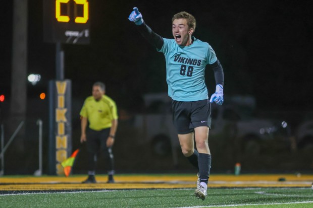 St. Laurence's Vin Diesi (88) celebrates after saving a penalty kick against Brother Rice during a CCL game in Burbank on Thursday, Sept. 19, 2024. (Troy Stolt / Daily Southtown)