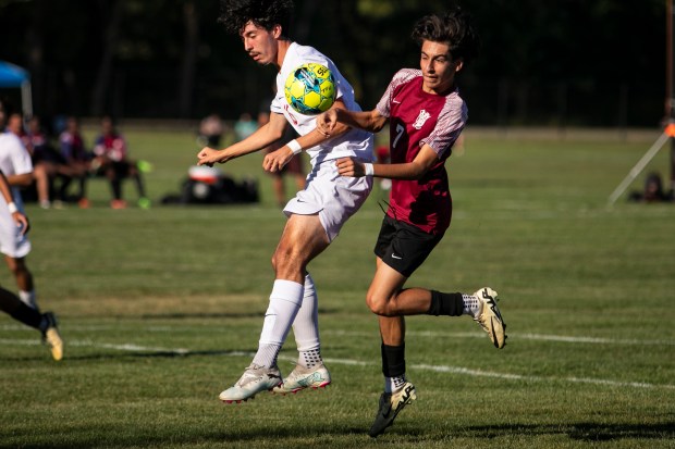 Homewood-Flossmoor's David Ocasio, left, and T.F. United's David Lopez (7) collide going up for a ball during a nonconference game in Calumet City on Wednesday, Sept. 4, 2024. (Vincent D. Johnson / Daily Southtown)