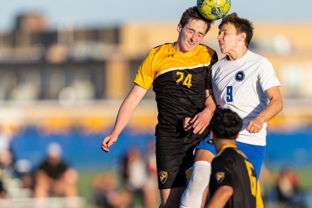 Andrew's Aaron O'Shea (24) and Lincoln-Way East's Finnegan Warner (5) go up for ball during the Windy City Ram Classic semifinals at Reavis in Burbank on Tuesday, Sept. 3, 2024. (Vincent D. Johnson / Daily Southtown)