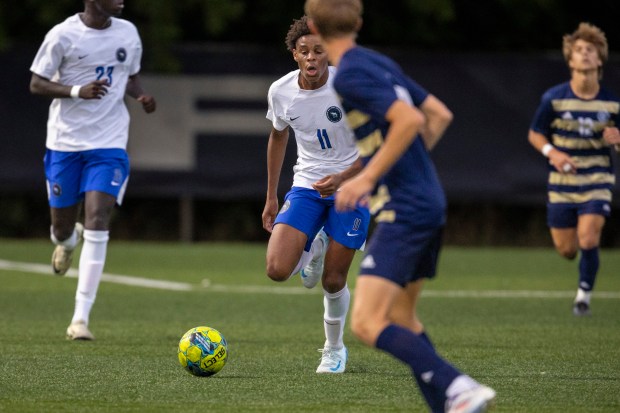 Lincoln-Way East's Kamden Williams (11) looks for some passing lanes as he bring the ball up against Lemont during the Windy City Ram Classic championship game at Reavis in Burbank on Thursday, Sept. 5, 2024. (Vincent D. Johnson / Daily Southtown)