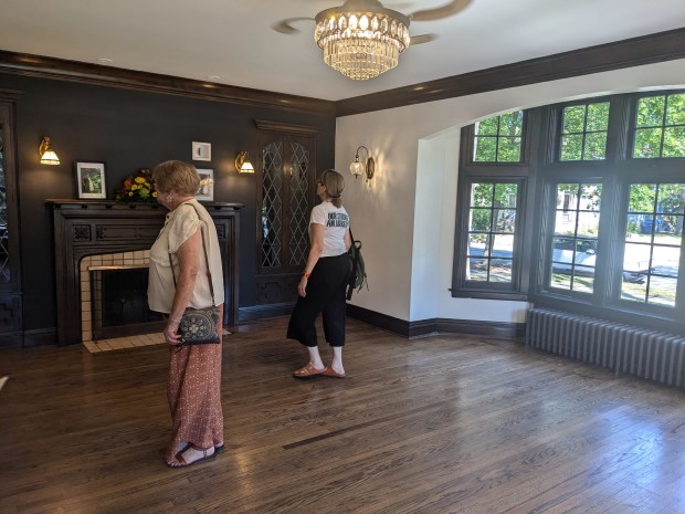 House tour attendees peruse the living room of the William and Florence Klein house Sept. 21, 2024, during the Blue Island House Walk. (Janice Neumann/for the Daily Southtown)