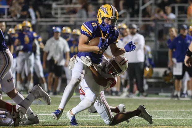 Sandburg's Charlie Snoreck (11) gets yards after the catch against Homewood-Flossmoor during a non conference game in Orland Park on Friday, Sept. 13, 2024. (Troy Stolt / Daily Southtown)