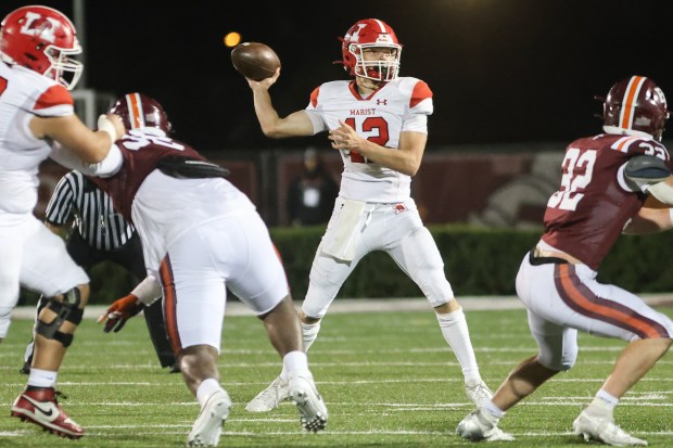 Marist's Jake Ritter (12) throws a pass against Brother Rice during a CCL/ESCC crossover game in Chicago on Friday, Sept. 6, 2024. (Troy Stolt / Daily Southtown)