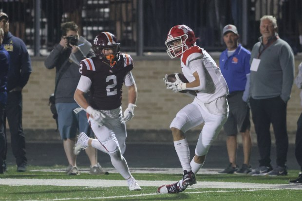 Marist's Gavin O'Brochta (1) scores a touchdown against Brother Rice during a CCL/ESCC crossover game in Chicago on Friday, Sept. 6, 2024. (Troy Stolt / Daily Southtown)