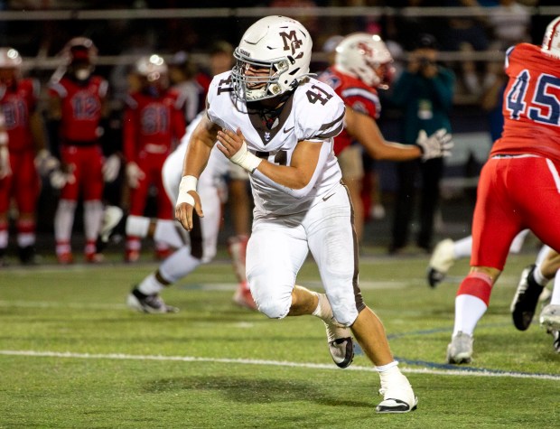 Mount Carmel's Matt Mucha (41) runs defense against the St. Rita Mustangs during a game at St. Rita High School in Chicago on Friday, Sept. 6, 2024. (Nate Swanson / Daily Southtown)