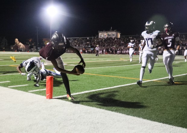 Argo's Javoris Cotton (1) dives for the pylon during a South Suburban conference game at Argo High School in Summit on Friday, Sept. 13, 2024. The touchdown was overturned by a holding penalty against Argo. (Talia Sprague / Daily Southtown)