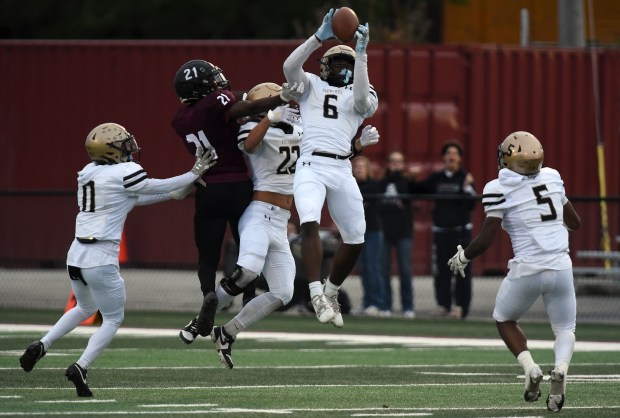 Richards' Ahmad Buchannan (6) pulls down an interception against Argo during a South Suburban Red game Friday, Sept. 27, 2024 in Summit, IL. (Steve Johnston / Daily Southtown)