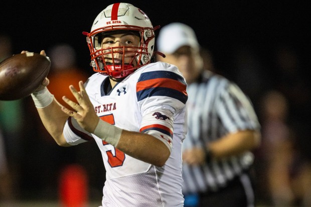 St. Rita's Steven Armbruster (5) pass downfield against Brother Rice during a CCL/ESCC game in Chicago on Friday, Sept. 13, 2024. (Vincent D. Johnson / Daily Southtown)