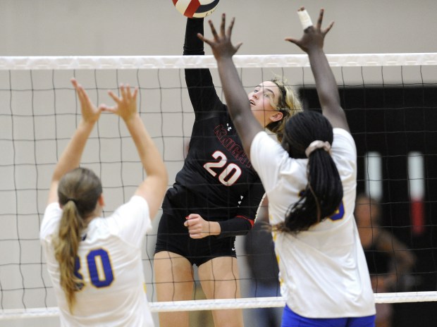 Lincoln-Way Central's Mya Donnelly (20) sends the ball past the Crete-Monee's Alexis Wieczorek (30) and Cadence Argue (35) during a nonconference match Monday, Sept. 9, 2024 in New Lenox, IL. (Steve Johnston/Daily Southtown)